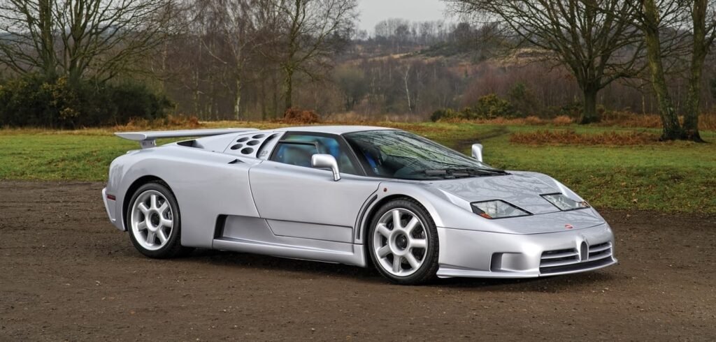 A silver Bugatti EB 110 SS parked in a natural setting, exemplifying the legendary craftsmanship and speed of the iconic model