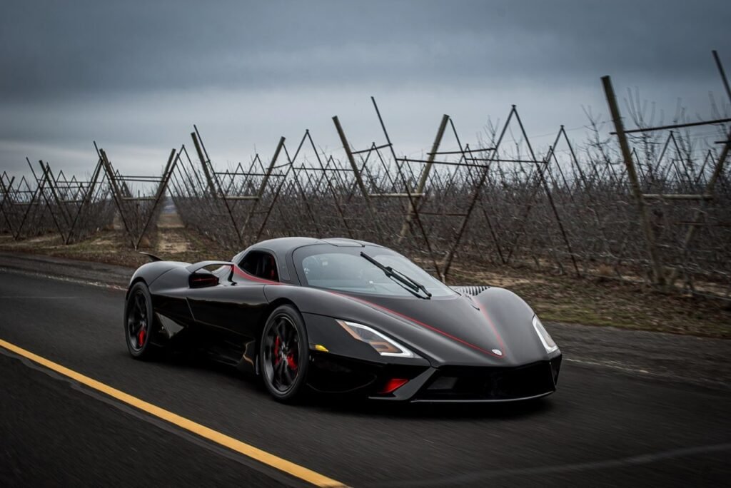 SSC Tuatara, an American engineering marvel achieving a verified top speed of 455 km/h, cruising along a country road