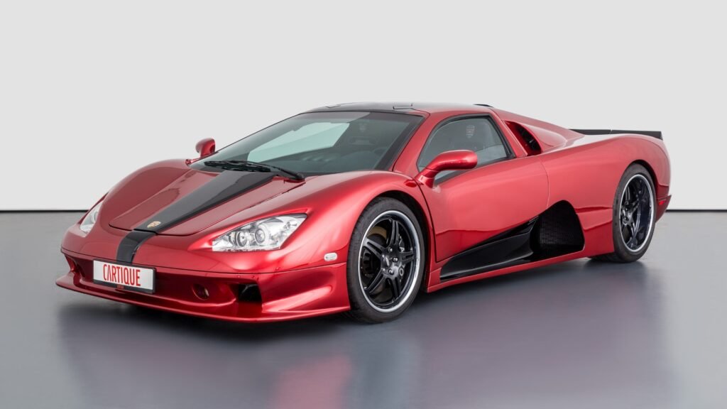 Red SSC Ultimate Aero TT in a studio setting, highlighting its aggressive styling and performance