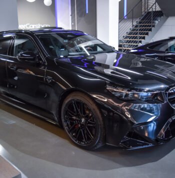 BMW M5 Touring 2025 for sale in Black Sapphire Metallic with 727 HP hybrid powertrain, carbon trim, and Bowers & Wilkins Diamond sound system.