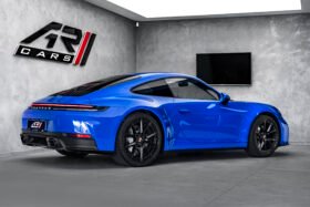 For Sale: Porsche 911 Carrera 2025 – Blue Metallic, Beige/Black Interior, 385 HP Flat-6, 1,900 km